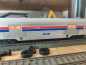 Preview: Märklin H0 AC 43600-1 Amtrak Streamliner Gepäckwagen aus Set / Licht / NEM / AMTK